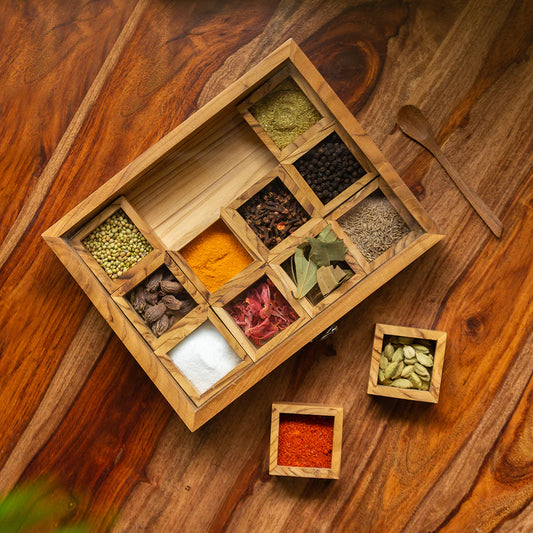 Medley of Masalas With Spoon In Teak Wood